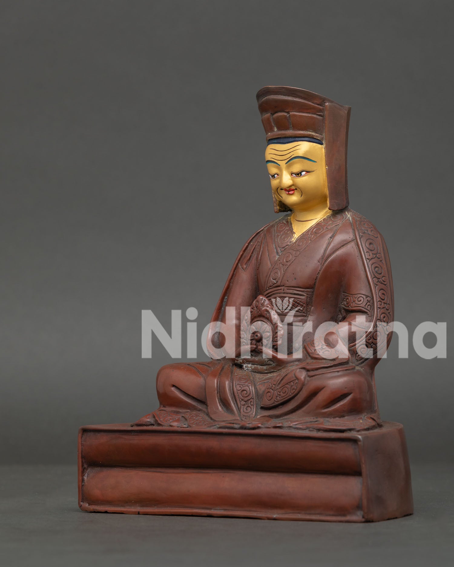 Gampopa Oxidized Copper Sculpture, Holding Cintamani Jewel