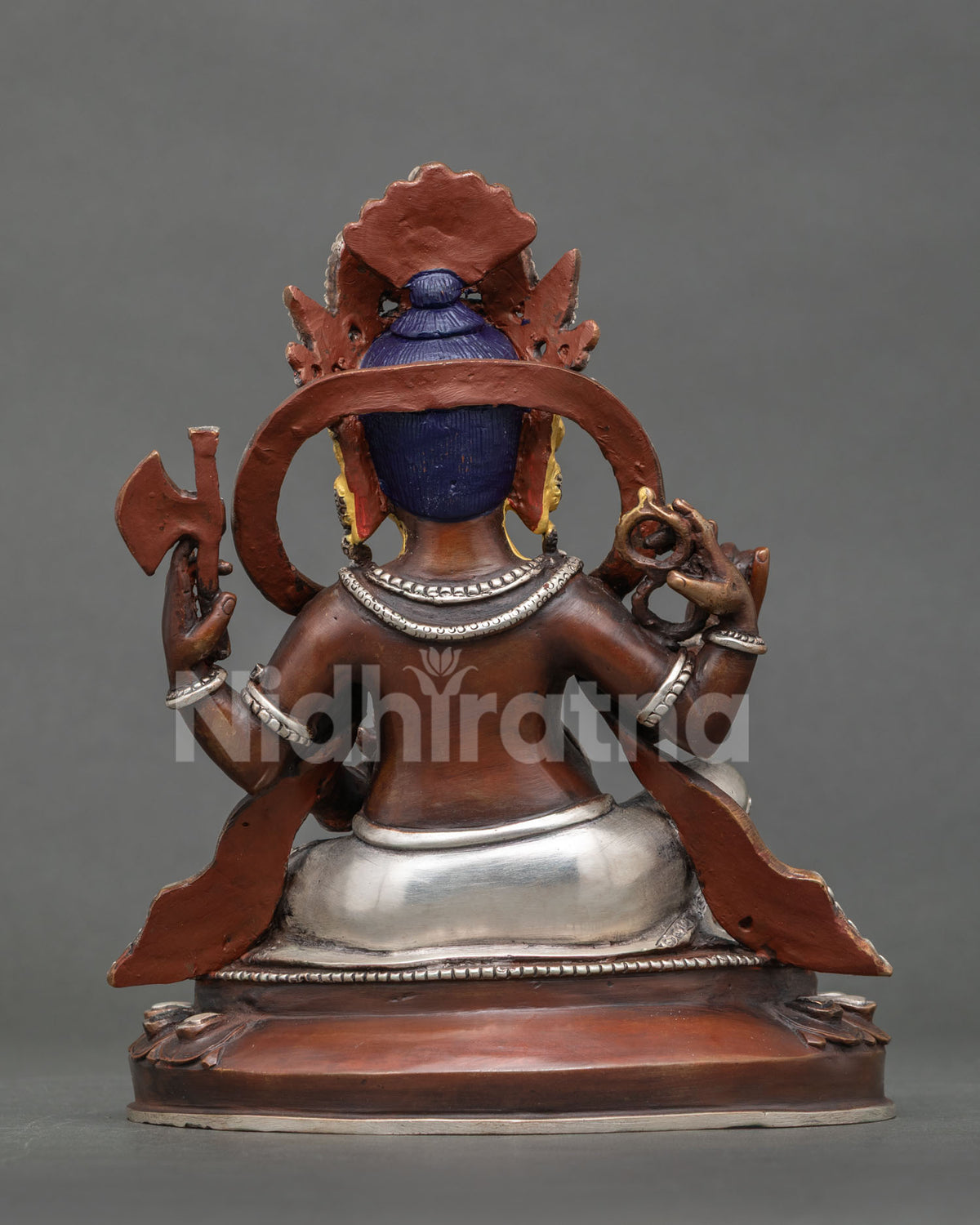 Ganesh statue close up 24K gold painted face intricate Newari craftsmanship sacred details.