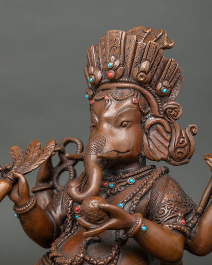 Ganesh Statue face close up with handcarved crown and halo.