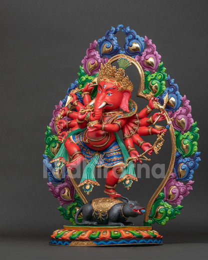 Ganesh statue left view showing flowing robes lotus seat and carved floral halo.