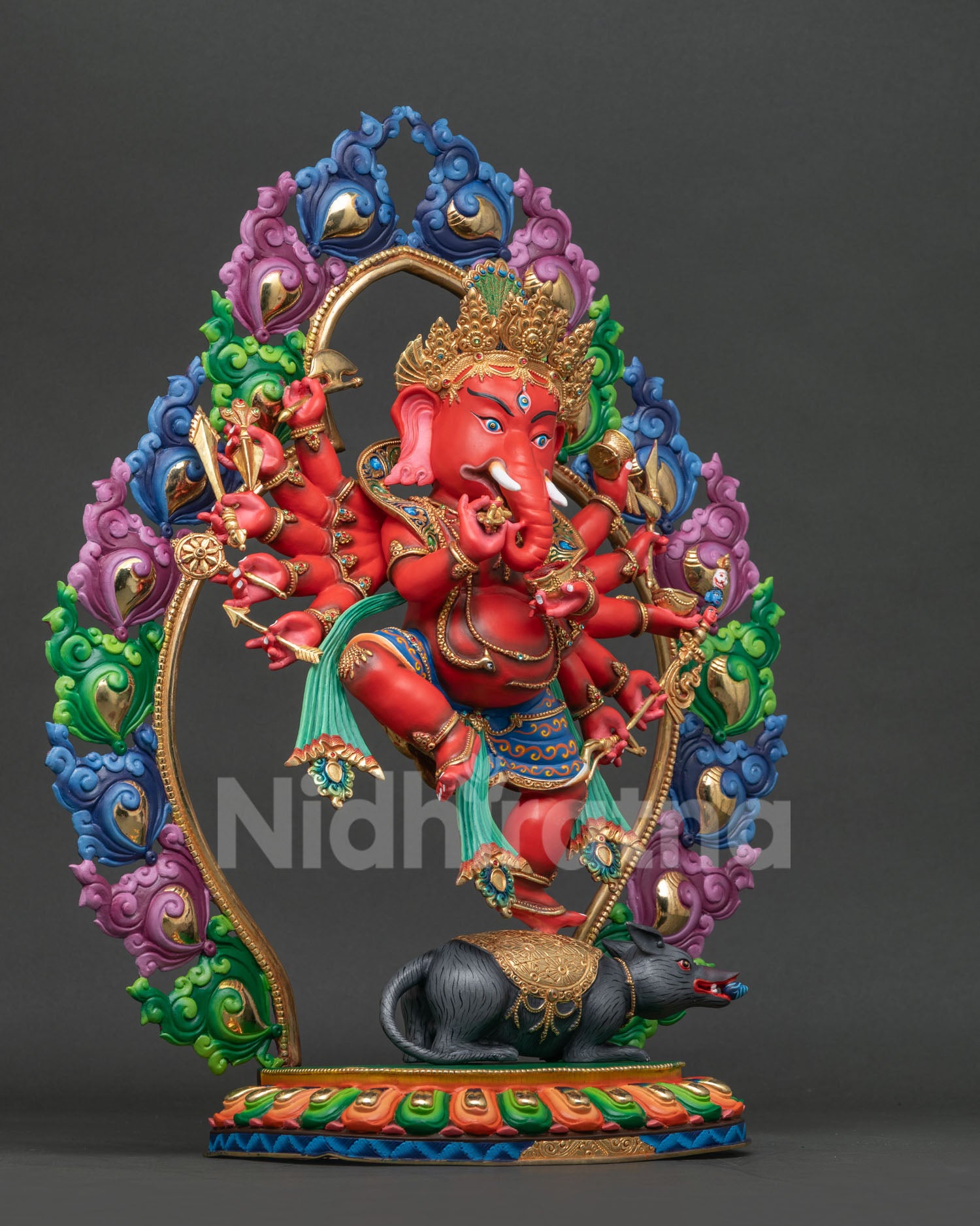 Ganesh statue right view showing twelve arms dancing posture and gemstone details.