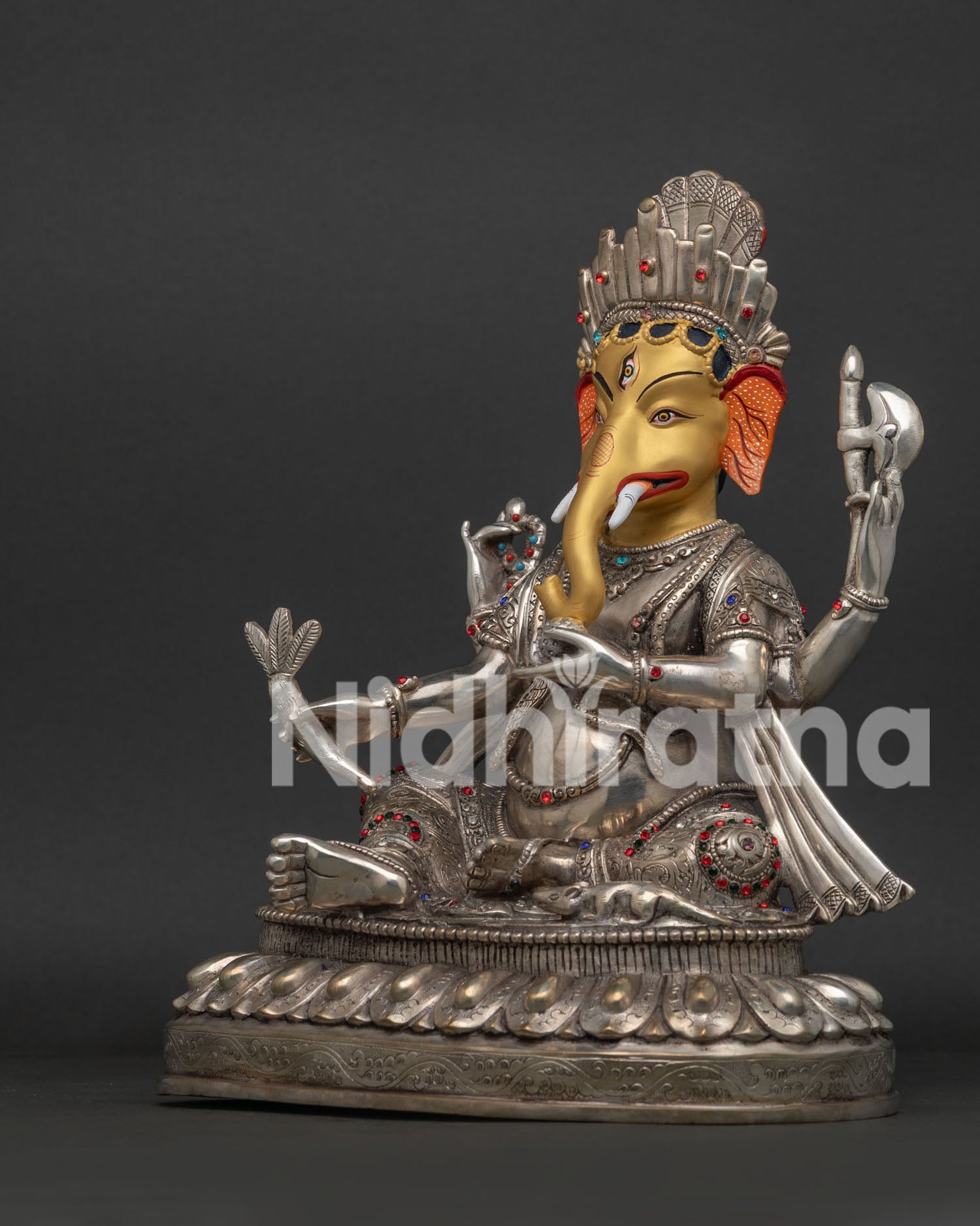 Ganesh statue left side view showing silver-plated copper idol with traditional Nepalese craftsmanship