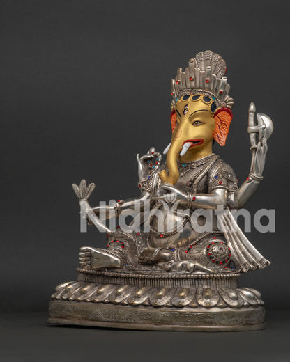 Ganesh statue left side view showing silver-plated copper idol with traditional Nepalese craftsmanship