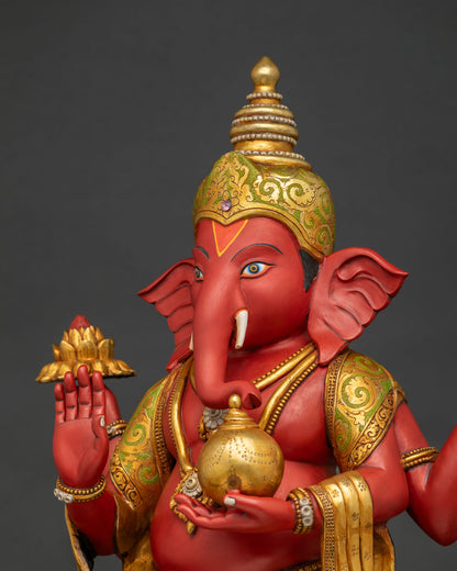 Ganesha idol elephant head close-up with blue eyes, tusks and gold crown detail