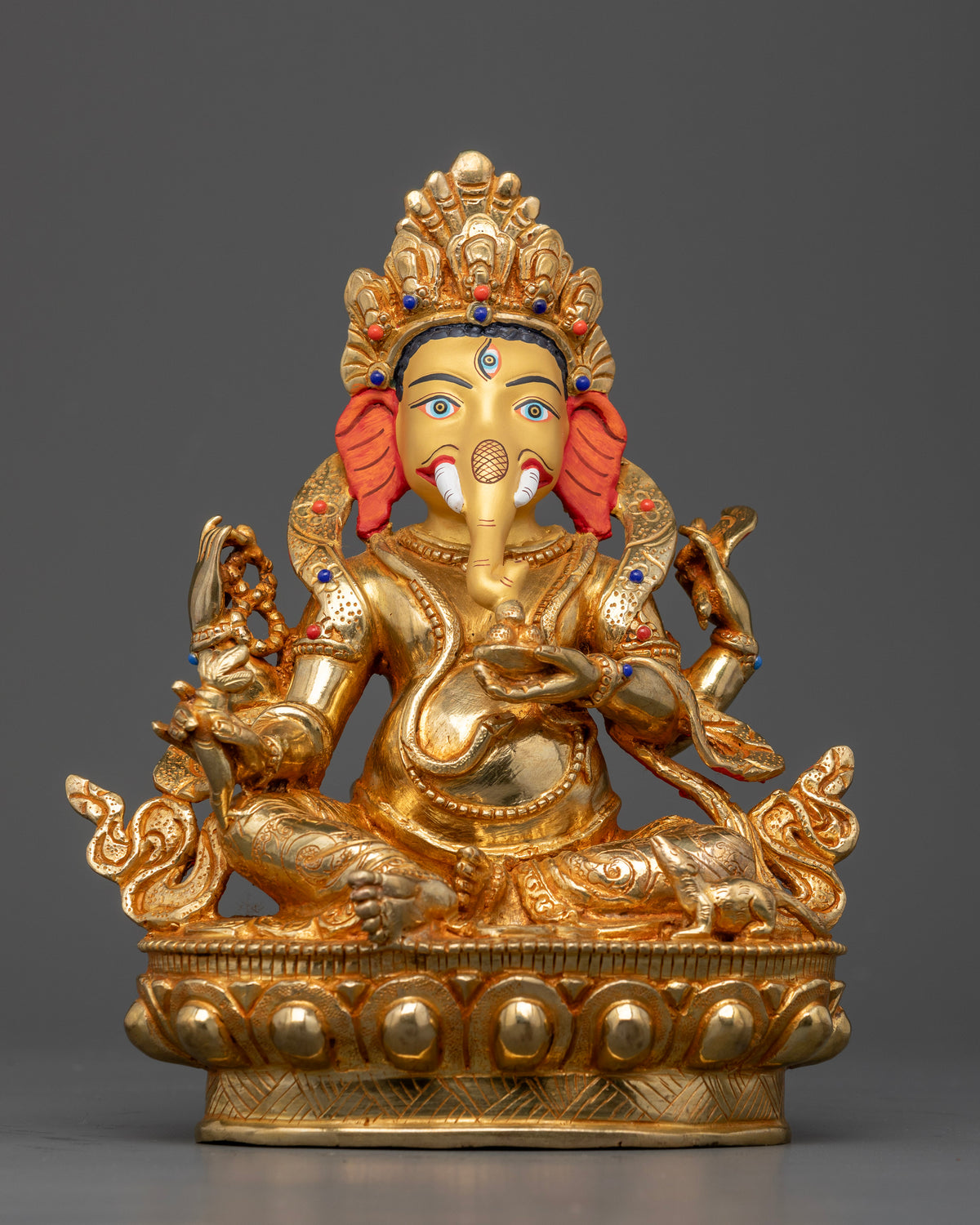 Ganesha statue crafted from copper with 24K gold fire gilding and semi-precious stones