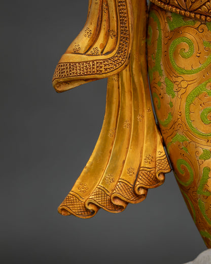Ganesha statue golden sash drape detail showing hand-painted floral design