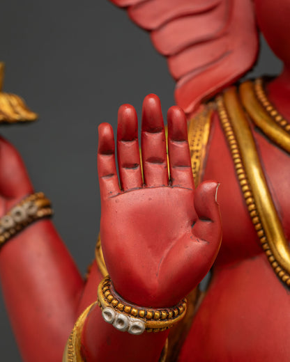 Ganesha statue hand in Abhaya mudra blessing gesture, gold bracelet detail