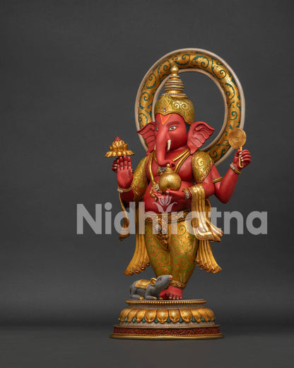 Ganesha statue upper body close-up showing gold jewelry and blessing hand gesture