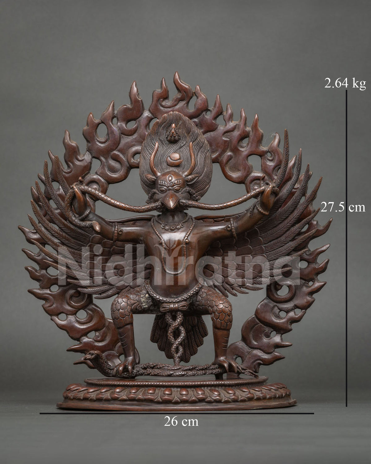 Garuda statue crafted from copper with a chemically oxidized finish standing on a hand carved lotus throne.