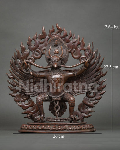 Garuda statue crafted from copper with a chemically oxidized finish standing on a hand carved lotus throne.