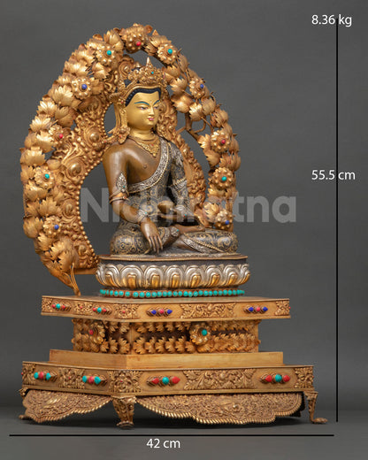 Gautama Buddha sculpture with gold gilded details semi precious stones and floral halo
