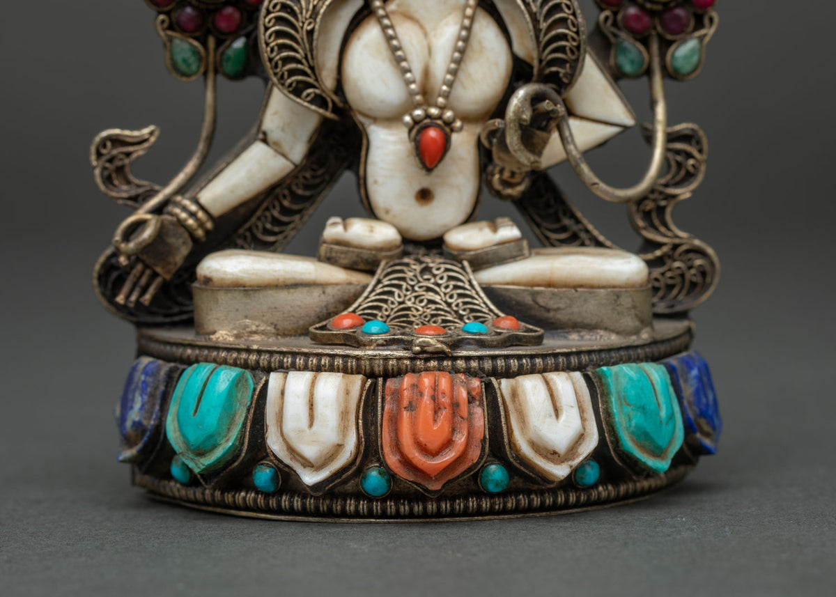 Gemstone-set lotus pedestal detail of handmade White Tara statue crafted in Nepal