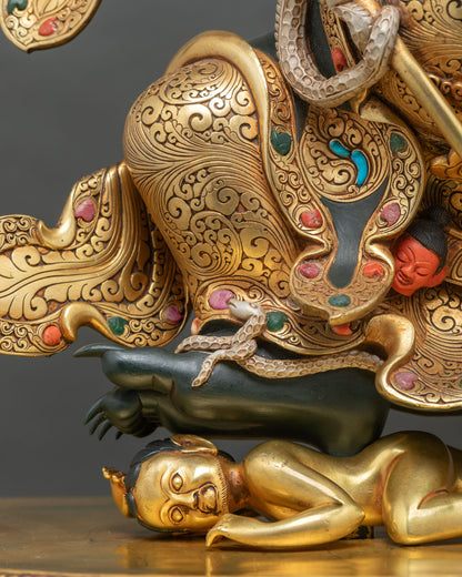 Gilded figure under Mahakala Bernagchen’s foot with hand-chased gold cloak and serpent
