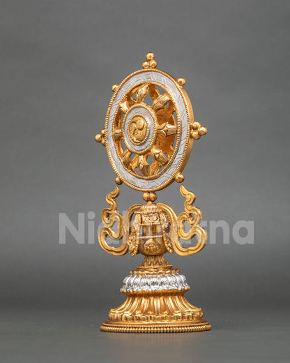 Gold and silver-plated Dharma Chakra featuring a detailed central hub and sacred Buddhist symbolism