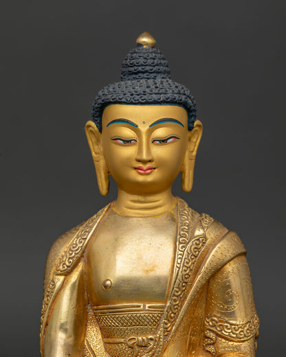 Gold fire gilded Amitabha Buddha sculpture with gold painted face.
