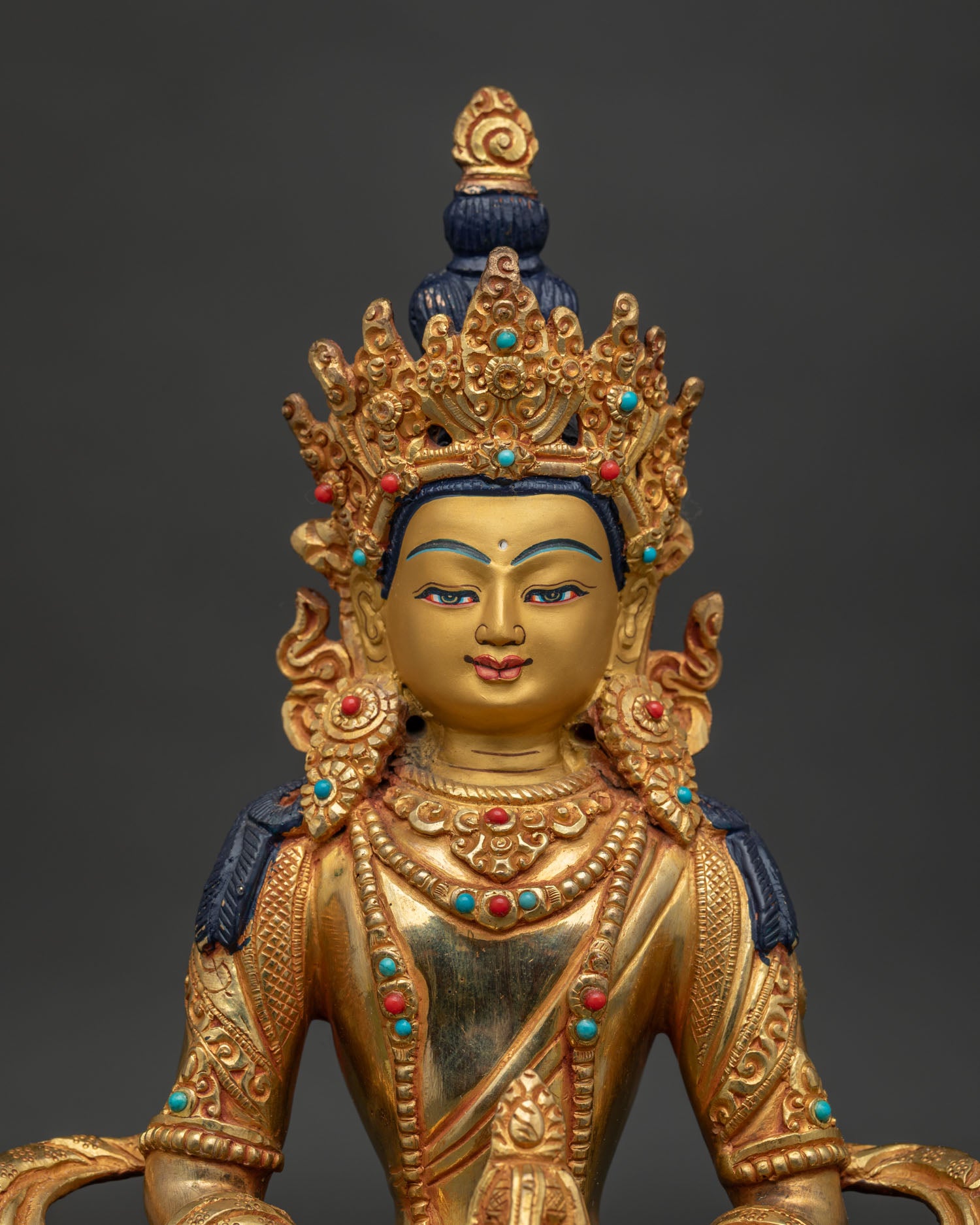 Gold fire gilded Amitayus statue with 24K gold painted face and stones.