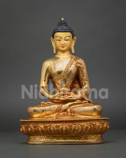 Gold fire-gilded copper Buddha statue holding a begging bowl in meditation mudra, Buddhist altar decor