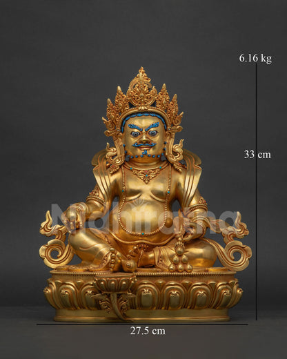 Gold fire-gilded Dzambhala statue seated on a lotus pedestal, front view