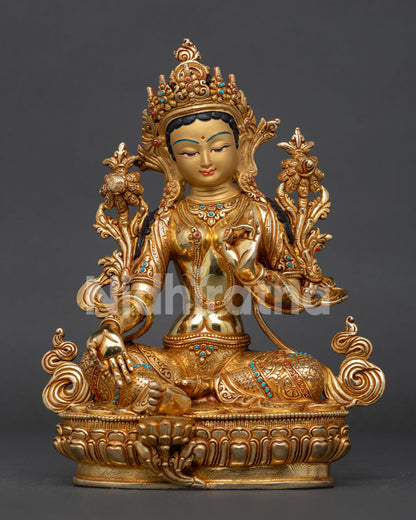 Gold fire gilded Green Tara statue with semi precious stone lotus pedestal.