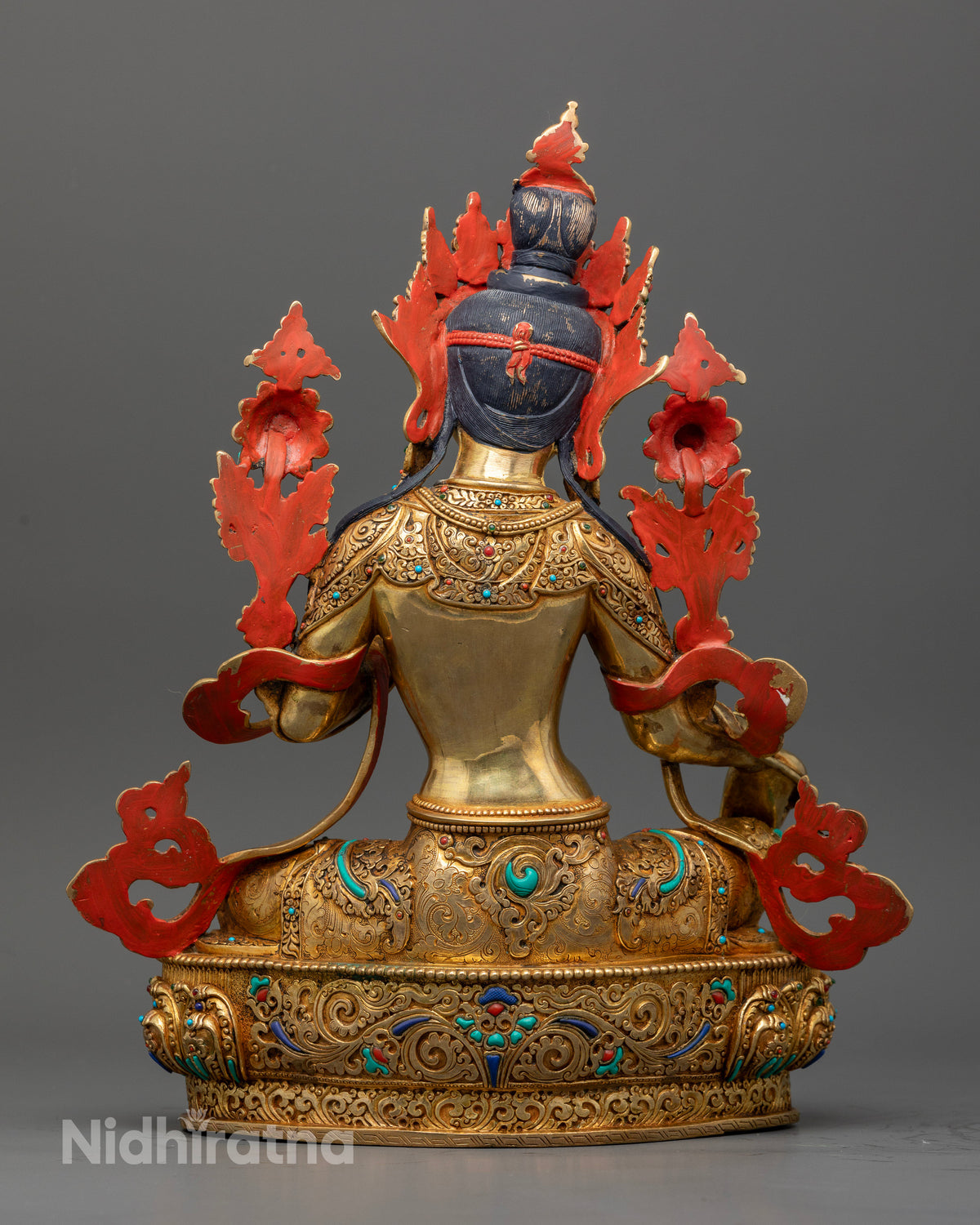 Gold fire gilded Green Tara statue with Varada Mudra on lotus pedestal.