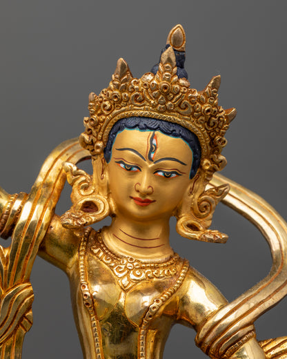 Gold fire gilded machig labdron statue with 24k gold painted face and lotus pedestal.