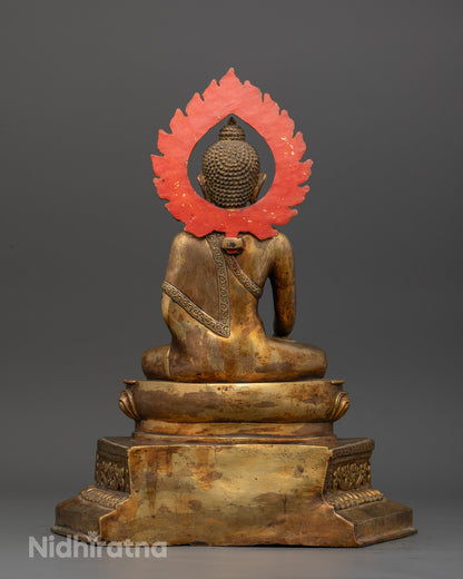 Gold-fire gilded Shakyamuni Buddha statue with antique copper finish.