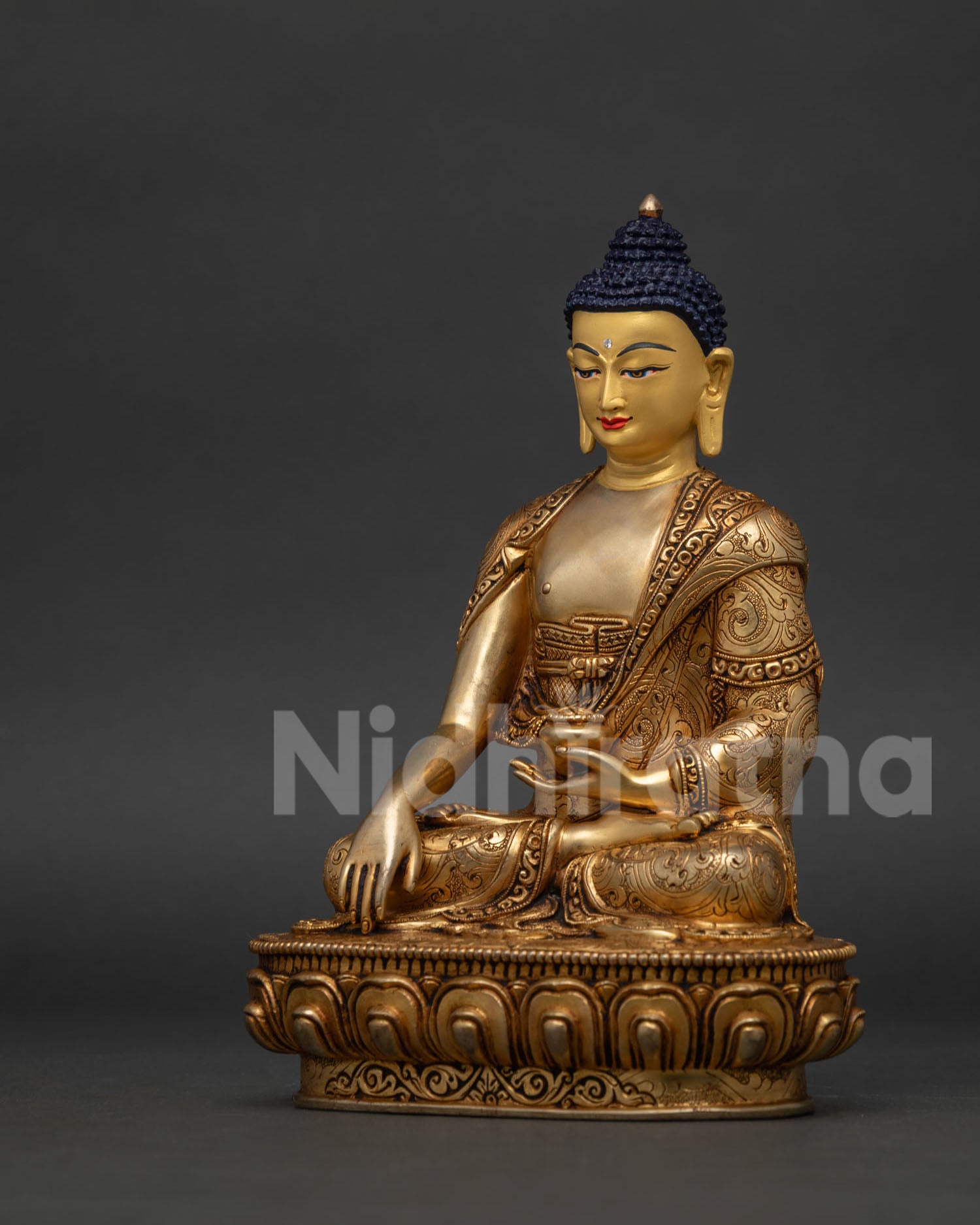 Gold fire gilded Shakyamuni Buddha statue with hand carved lotus pedestal from Nepal.