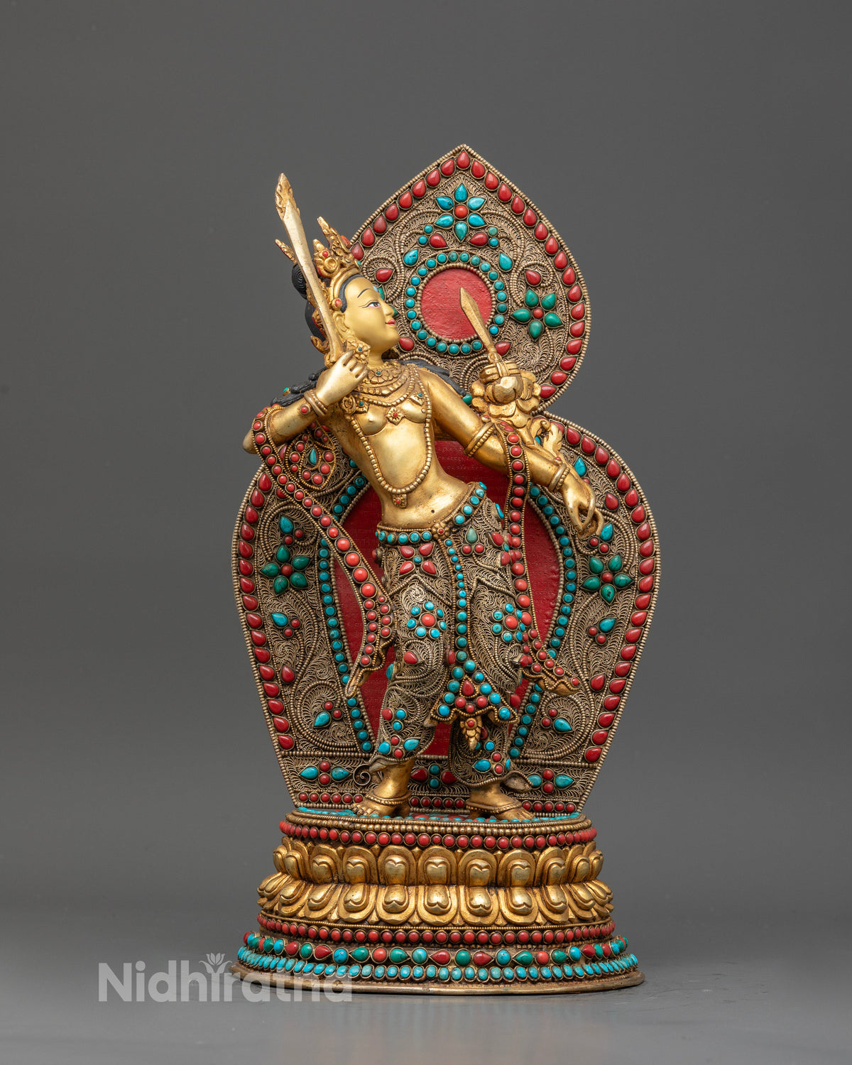Gold fire gilded Standing Manjushri statue with semi precious stone inlays.