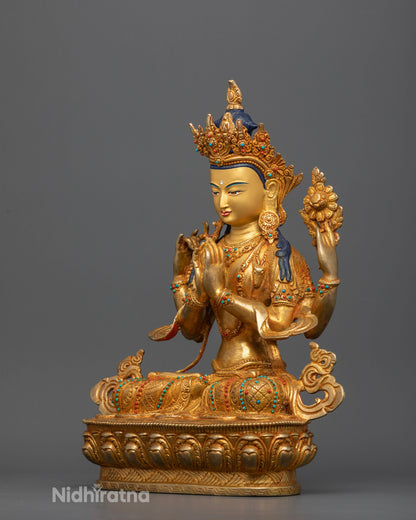 Gold gilded Chenrezig Buddhist statue with ornate crown and intricate floral engravings