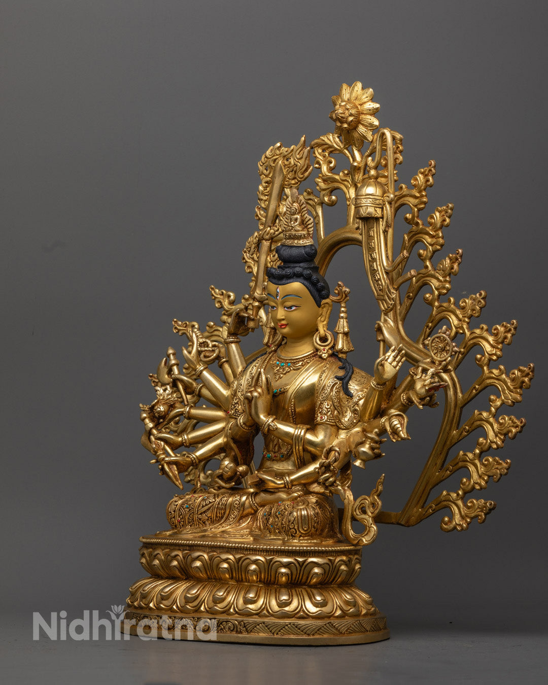 Gold gilded Chundi Buddhist statue with radiant face and detailed ornaments