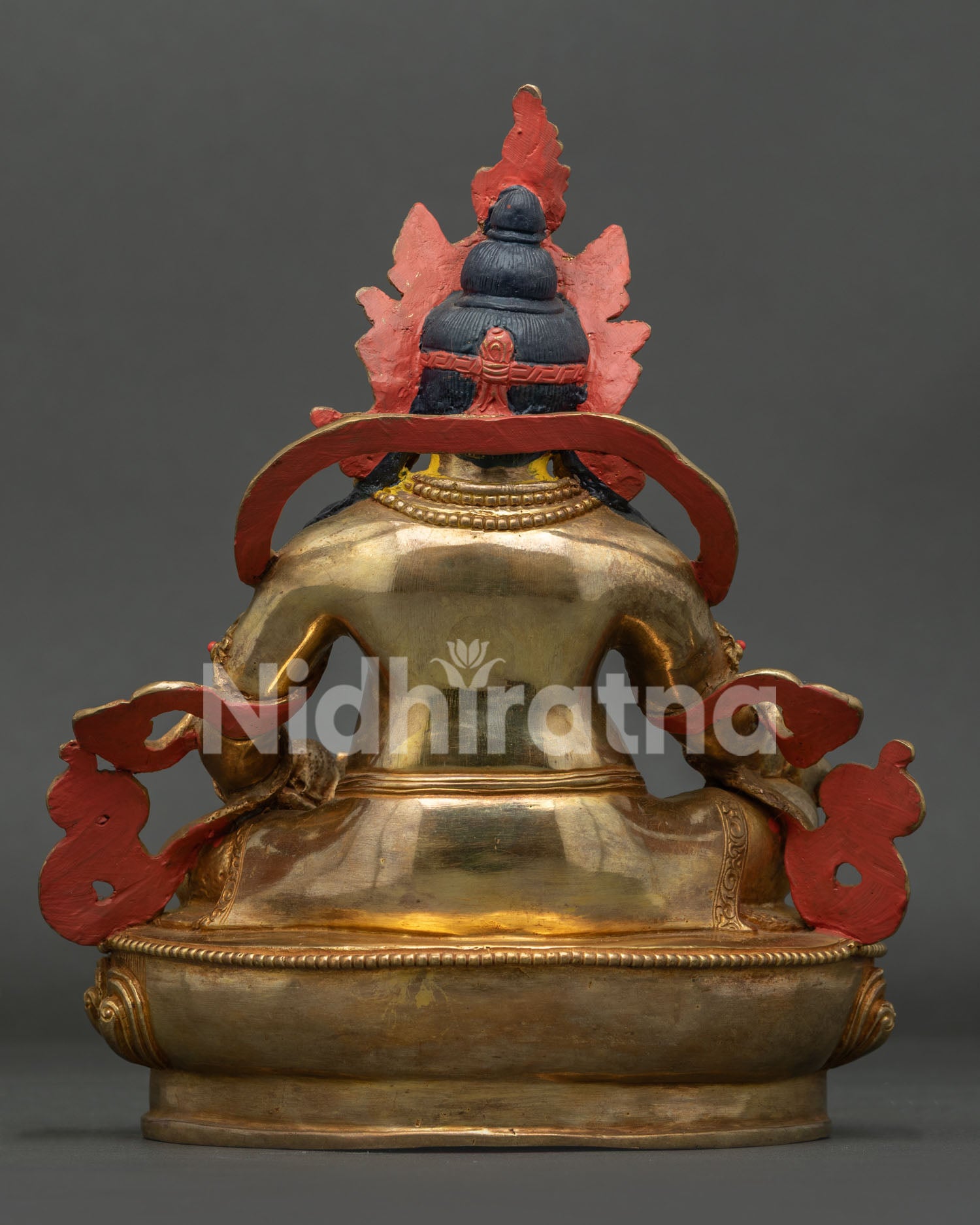 Gold gilded Dzambhala statue with Newari craftsmanship and ornate lotus pedestal.