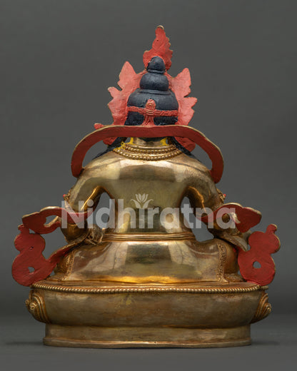 Gold gilded Dzambhala statue with Newari craftsmanship and ornate lotus pedestal.