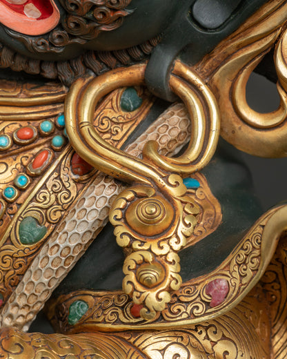 Gold gilded earring ornament and white serpent with gemstone inlay on Mahakala Bernagchen statue