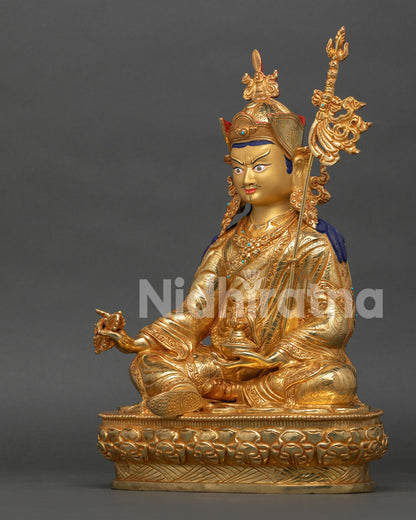 gold gilded guru padmasambhava statue with copper body and meditation altar artwork