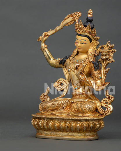 Gold gilded manjushri statue crafted by newari artisans using lost wax casting.