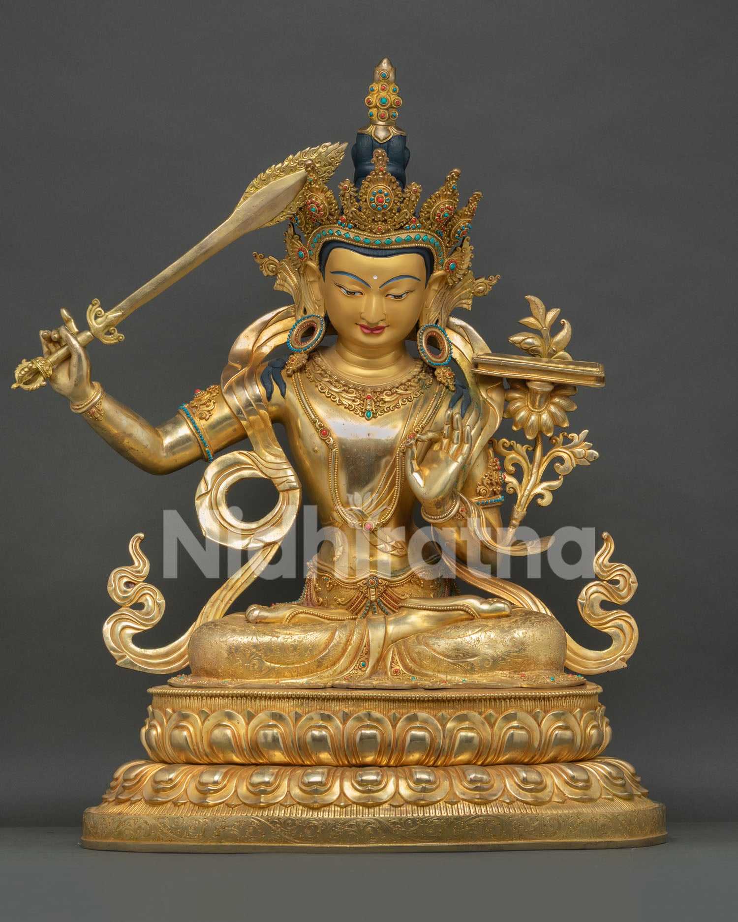 Gold-gilded Manjushri statue Nepal, full front view seated on lotus base
