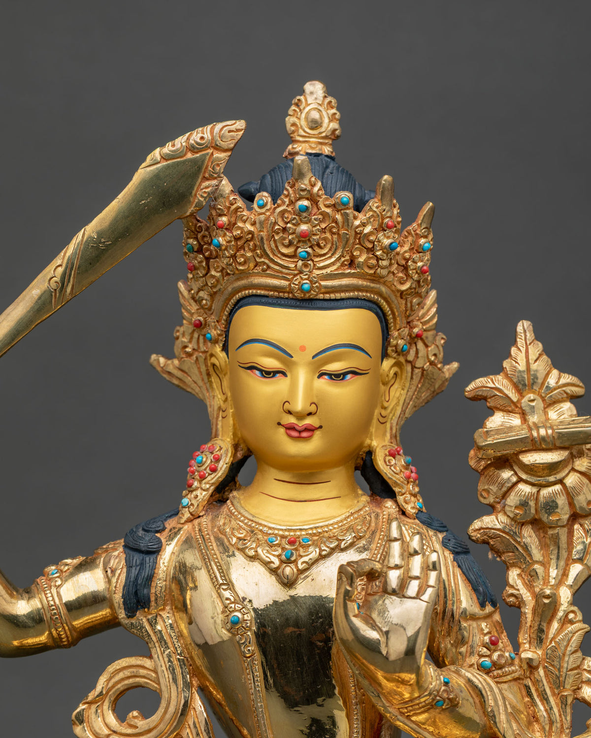 Gold gilded Manjushri statue with 24K gold painted face and stones.