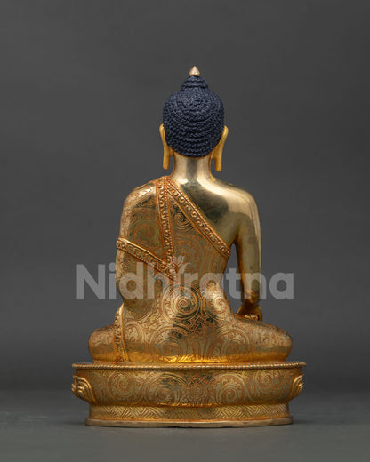 Gold gilded Mitrugpa statue Newari craftsmanship floral cloud robe detail.