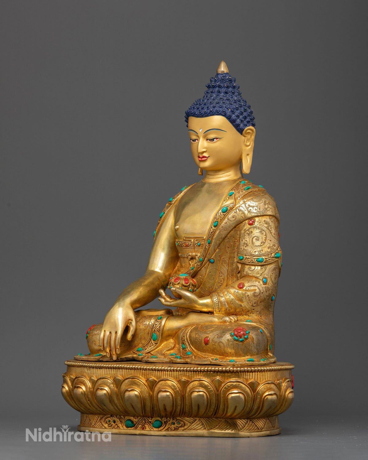 Gold gilded Shakyamuni Buddha Statue with floral robe carvings and inlaid gemstones