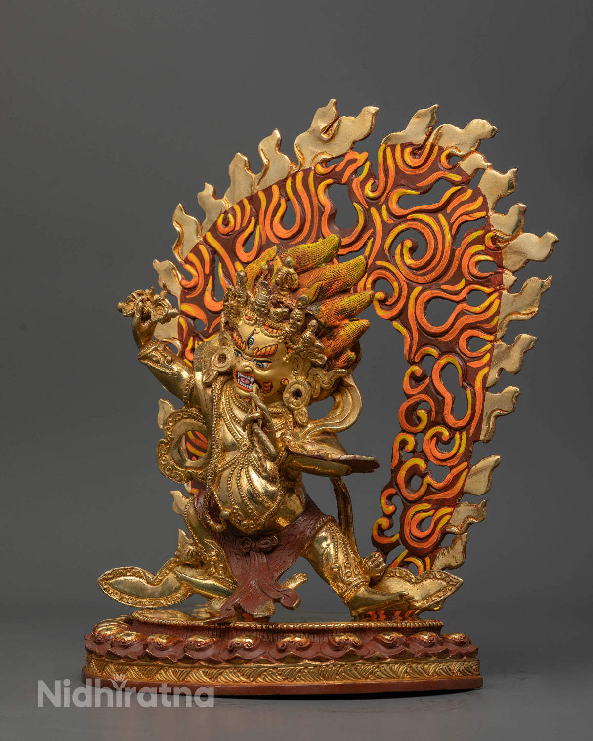 Gold gilded Vajrapani Buddhist statue with flaming wisdom fire halo