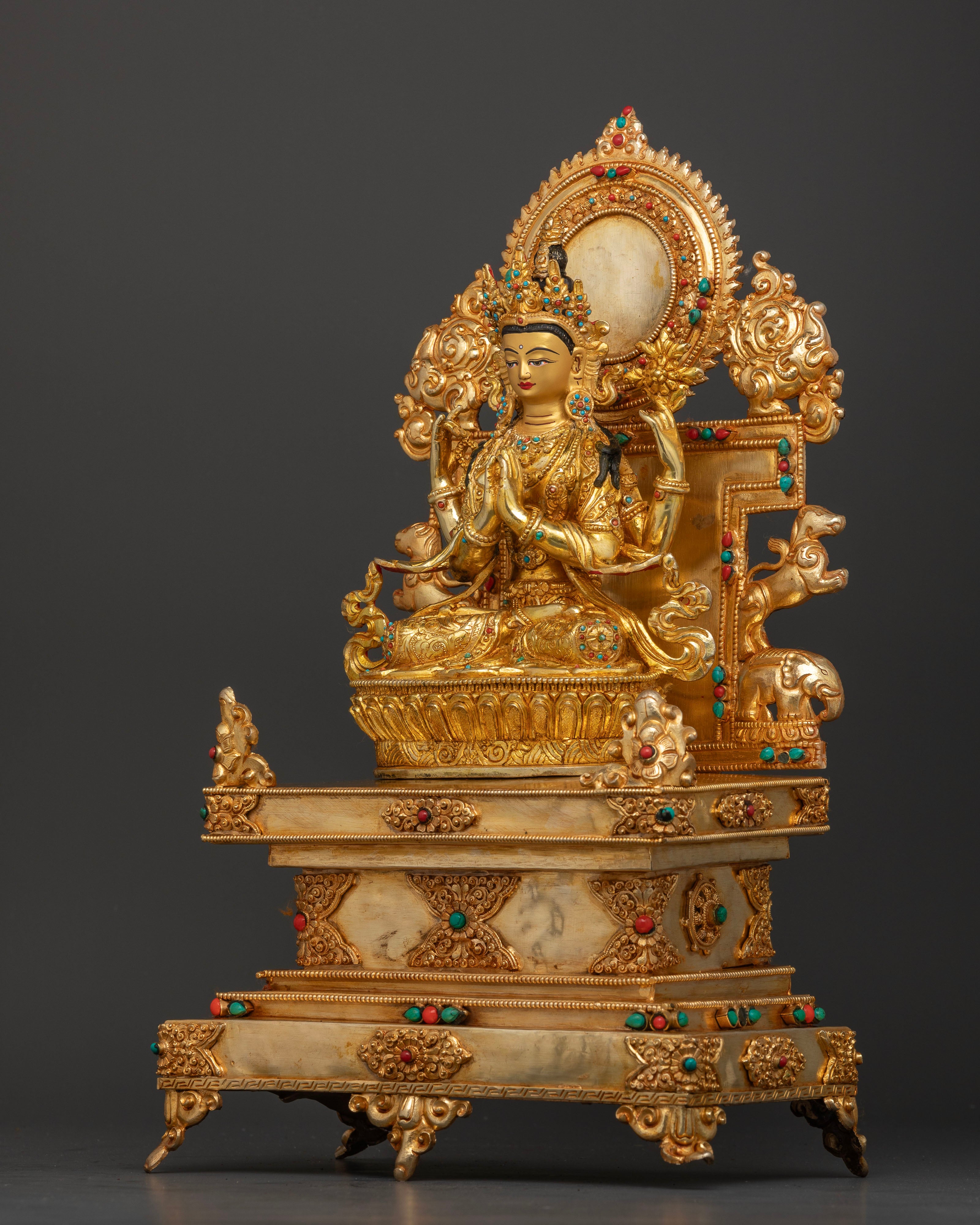 Gold painted face of Chenrezig Statue with semi precious stone inlays