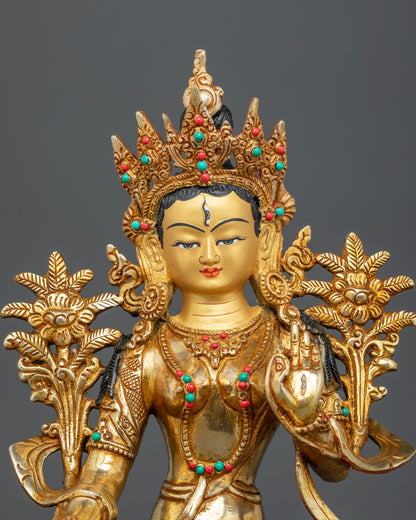 Gold painted face of White Tara Statue with semi precious stone inlays
