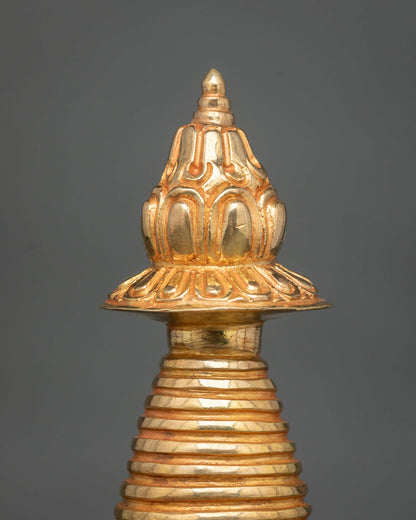 Gold-plated Kadampa Stupa featuring intricate floral carvings and traditional Nepalese metalwork