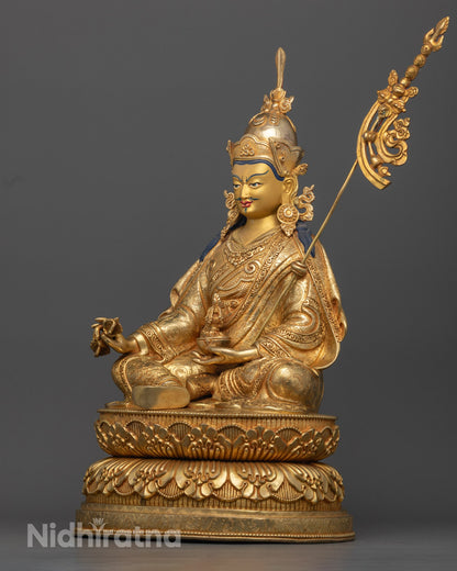  gold-plated Guru Rinpoche Statue showcasing Vajra and Khatvanga with spiritual symbolism