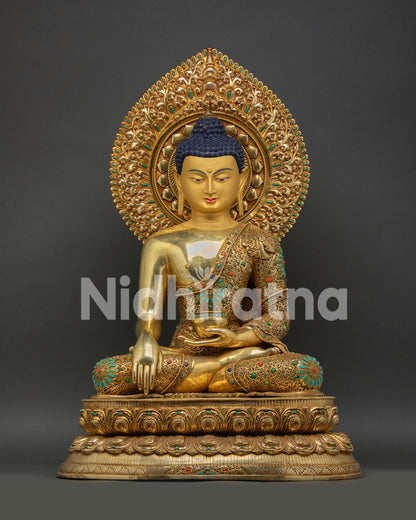Gold Shakyamuni Buddha statue in Bhumisparsha mudra on lotus throne