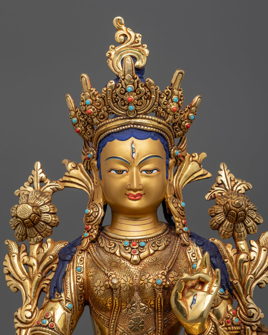 pure gold face of white tara statue