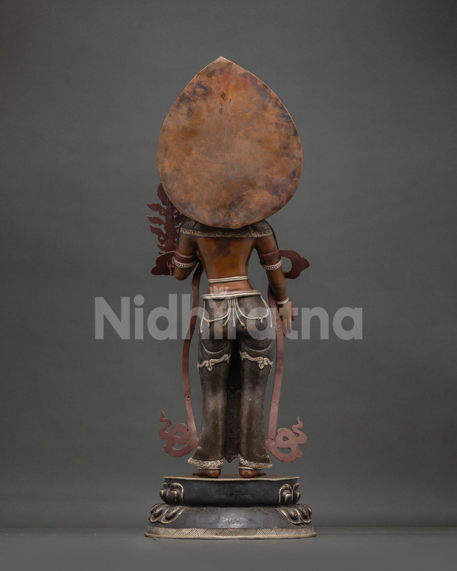 Green Tara back view—handmade oxidized copper statue showing ornate halo & robe patterns