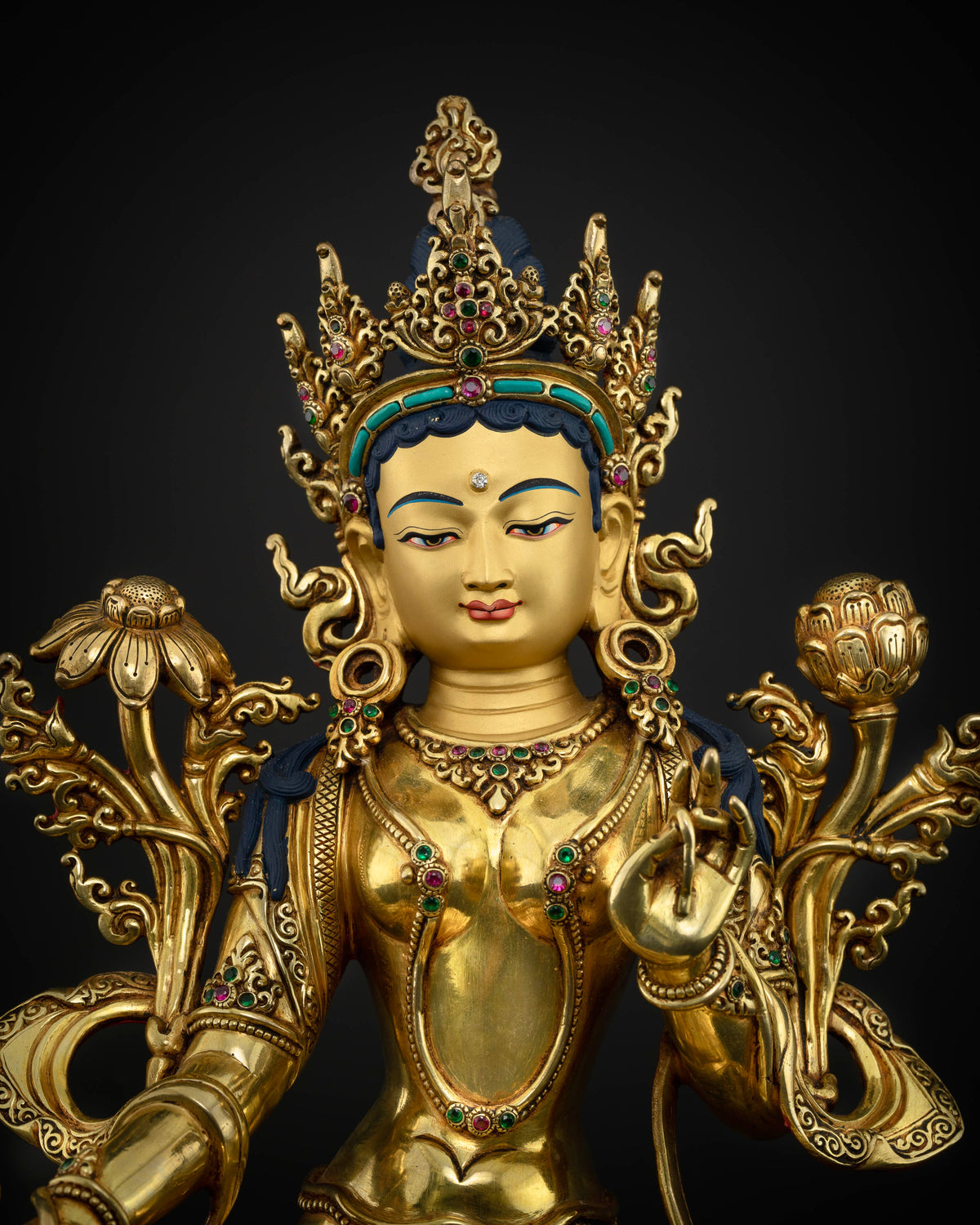 Green Tara Buddhist deity statue with gold painted face and semi precious stones