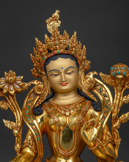 Green Tara Buddhist statue close up copper gold semi-precious stones Newari craftsmanship Nepal