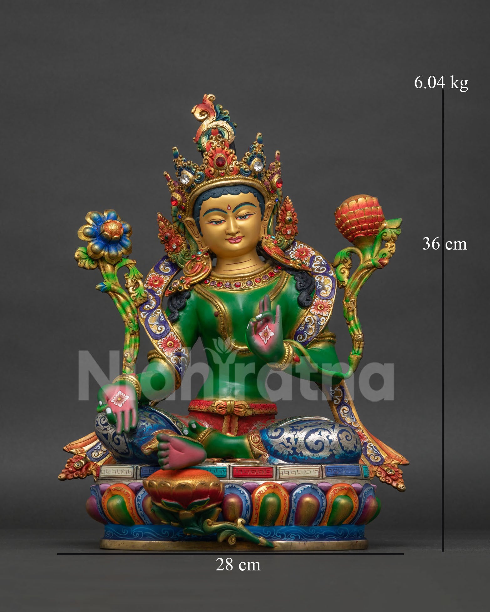 Green Tara Buddhist statue front view with gold painted face and multicolor robe